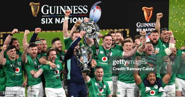 Dublin , Ireland - 18 March 2023; Ireland players celebrate with the Six Nations trophy and Triple Crown trophy after the Guinness Six Nations Rugby...