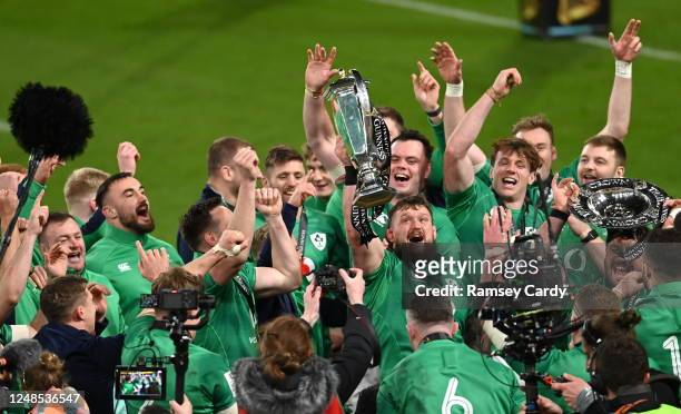 Dublin , Ireland - 18 March 2023; Andrew Porter of Ireland celebrates with the Six Nations trophy after the Guinness Six Nations Rugby Championship...
