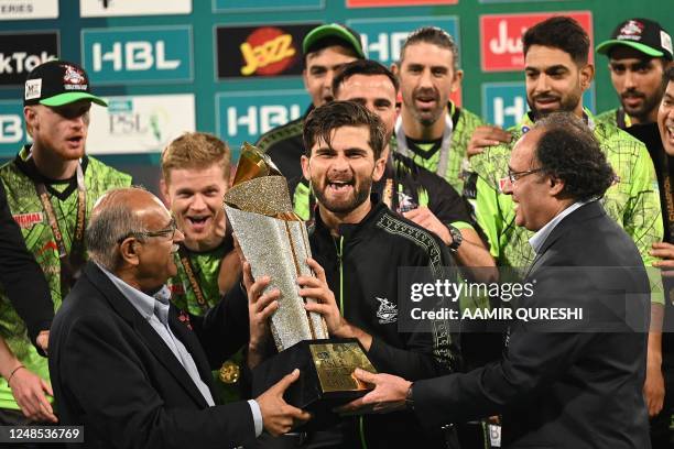 Lahore Qalandars' captain Shaheen Shah Afridi receives the FSL Final Trophy during a ceremony at the end of the Pakistan Super League Twenty20...