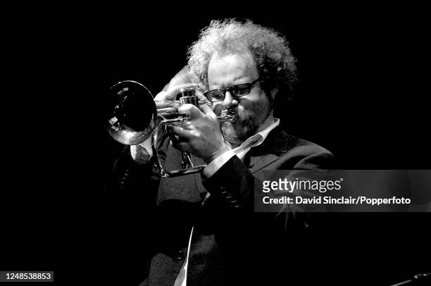 English film director and musician Mike Figgis performs live on stage playing a trumpet at the Purcell Room in London on 18th November 2005.
