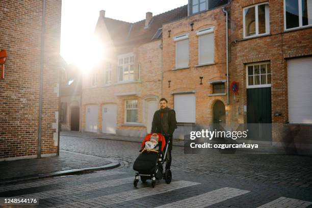 happy father and daughter are walking - belgium street stock pictures, royalty-free photos & images