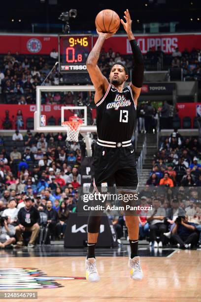 Paul George of the LA Clippers shoots a three point basket during the game against the Orlando Magic on March 18, 2023 at Crypto.Com Arena in Los...