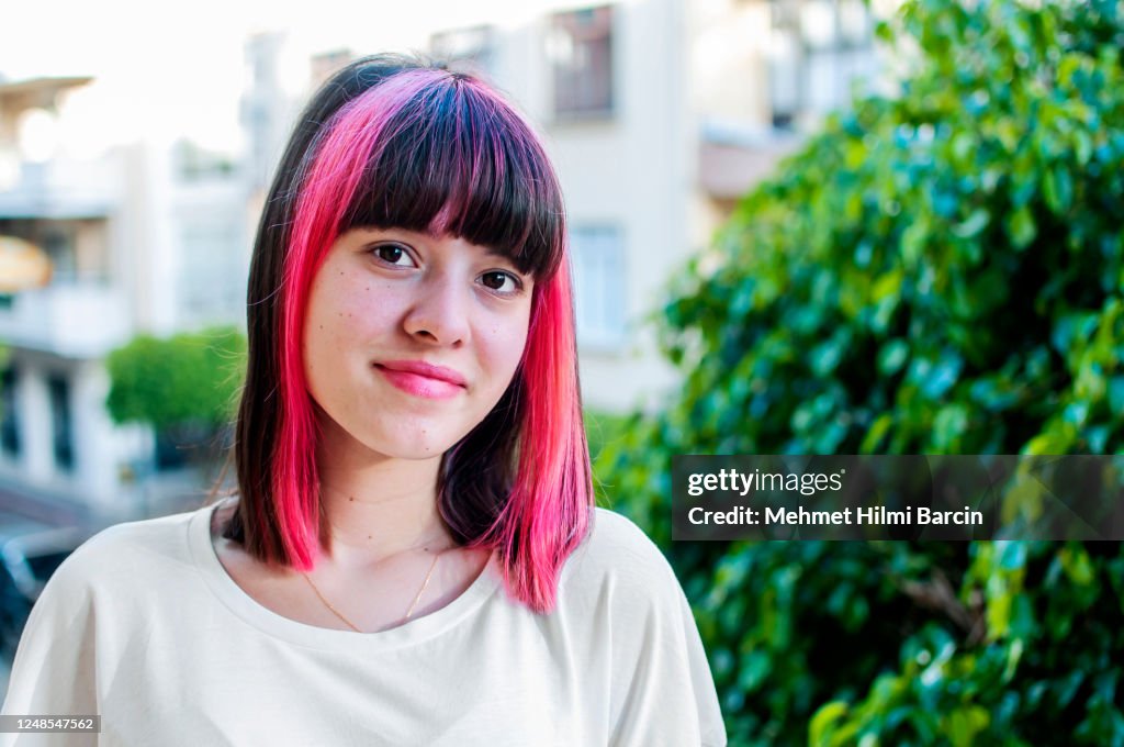 Teenager with pink hair