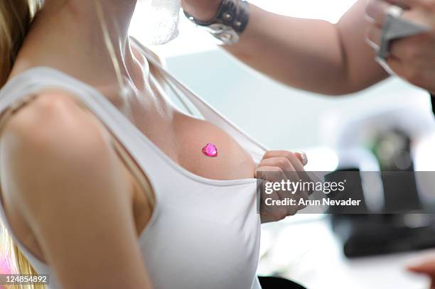 Model backstage at the Betsey Johnson Spring 2012 fashion show during Mercedes-Benz Fashion Week at The Theater at Lincoln Center on September 12,...