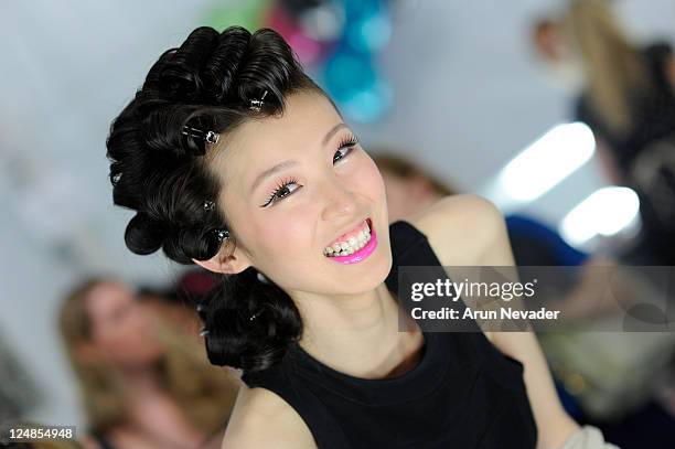 Model backstage at the Betsey Johnson Spring 2012 fashion show during Mercedes-Benz Fashion Week at The Theater at Lincoln Center on September 12,...