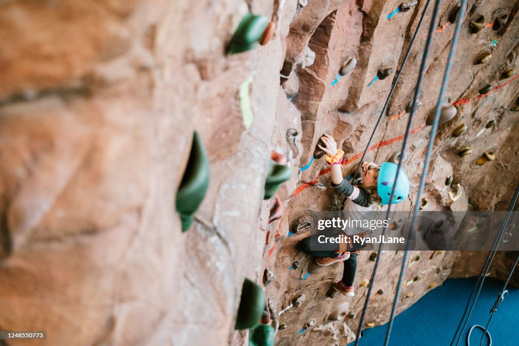 Child Climbing Indoor Rock Wall