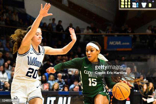 Brittni Moore of the Cleveland State Vikings drives to the basket against Maddy Siegrist of the Villanova Wildcats during the first round of the 2023...