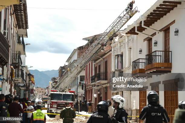 Firefighters conduct search and rescue operations after 6,8 magnitude earthquake hit the town of Balao in Ecuadorâs Azuay province on March 18, 2023...