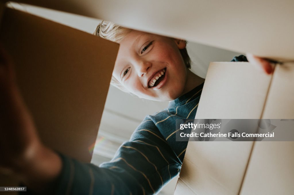 Happy Boy looking into a Box