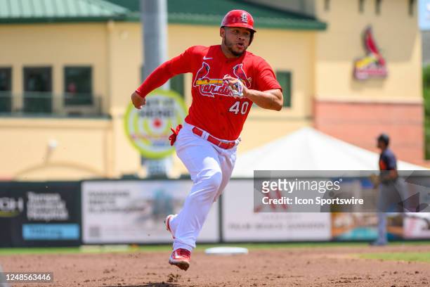St. Louis Cardinals catcher Willson Contreras runs to third base as he scores a run during an MLB spring training game between the Detroit Tigers and...