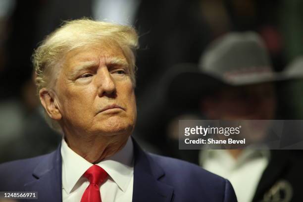 Former United States President Donald Trump stands on the floor during the Division I Mens Wrestling Championship held at the BOK Center on March 18,...