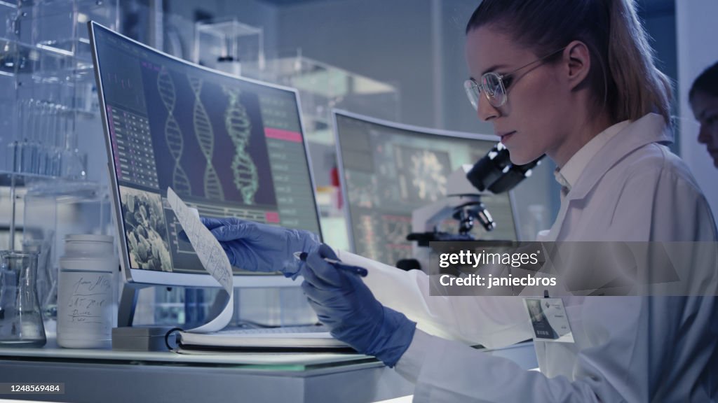 Lab Computer Dna Female Research Team Studying Dna Mutations Computer Screens With Dna ...