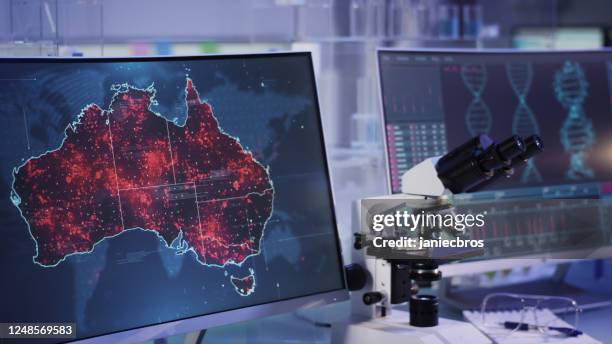 futuristic laboratory. disease outbreaks on australia map. scanning dna mutations - digital dna stock pictures, royalty-free photos & images