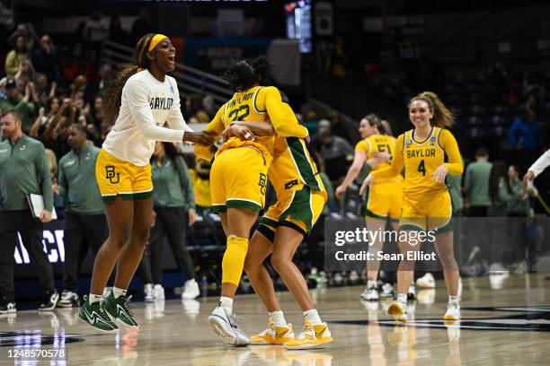 The Baylor University Bears celebrate on the court after their win against the University of Alabama Crimson Tide during the first round of the 2023...