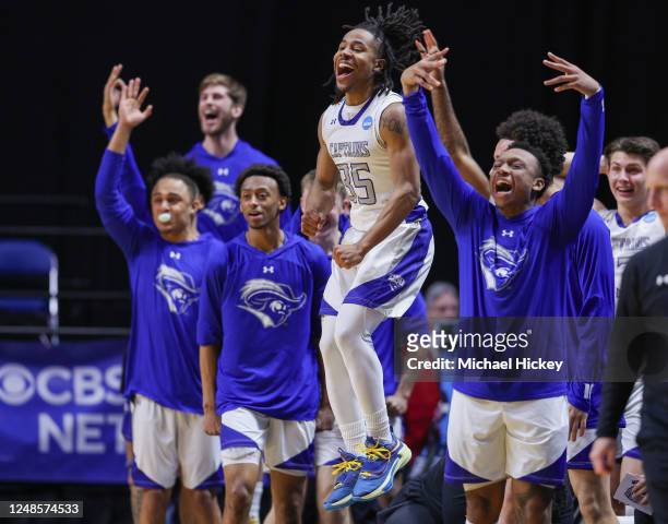 Ty Henderson of Christopher Newport Captains and members of the bench celebrate during the second half against the Mount Union Purple Raiders during...