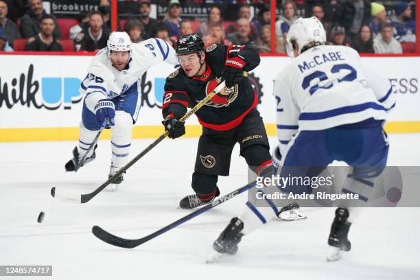 Alex DeBrincat of the Ottawa Senators shoots the puck against the Toronto Maple Leafs at Canadian Tire Centre on March 18, 2023 in Ottawa, Ontario,...