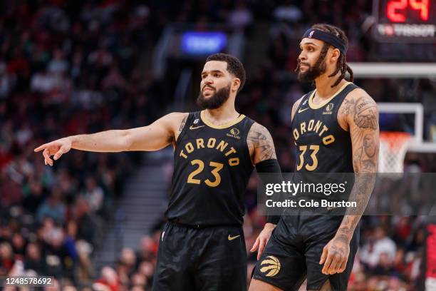 Fred VanVleet of the Toronto Raptors talks with Gary Trent Jr. #33 during second half of their NBA game against the Minnesota Timberwolves at...