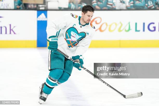 Logan Couture of the San Jose Sharks skates during warmups wearing special Pride Night jerseys before the game against the New York Islanders at SAP...