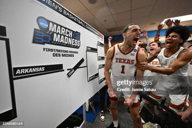 Dylan Disu and Dillon Mitchell of the Texas Longhorns celebrate after adding their team to the bracket following their 71-66 win against the Penn...