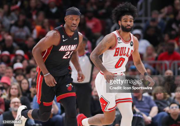 Chicago Bulls guard Coby White and Miami Heat forward Jimmy Butler looks on during a NBA game between the Miami Heat and the Chicago Bulls on March...