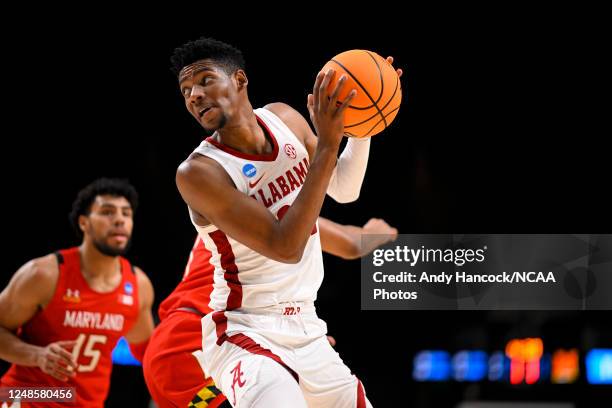 Brandon Miller of the Alabama Crimson Tide holds the ball in the first half of the game against the Maryland Terrapins during the second round of the...