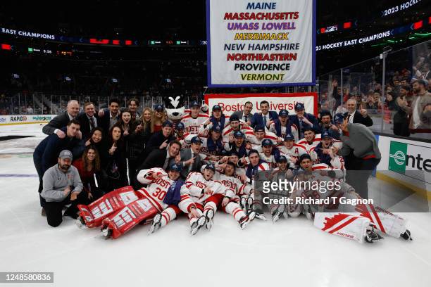 The Boston University Terriers celebrate after capturing the Hockey East championship against the Merrimack Warriors at TD Garden on March 18, 2023...