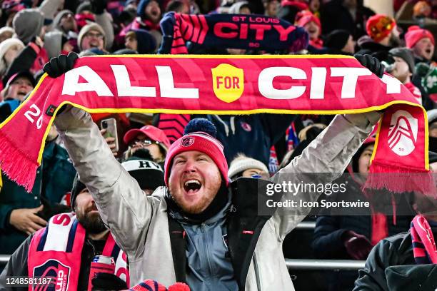 St. Louis City fan holds up a All for City scarf while celebrating the teams third goal of the game during a game between San Jose Earthquake and St....