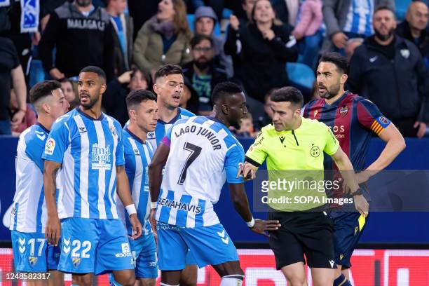 Malaga CF players seen protesting to referee Oliver de la Fuente Ramos during the LaLiga Smartbank match between Malaga CF and Levante UD at La...