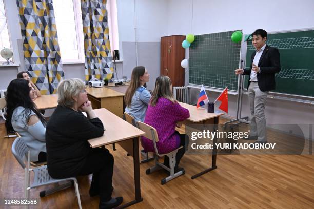 The ChineseFirst language centre co-founder Wang Yinyu teaches a Chinese class for adults, in the town of Reutov, outside Moscow, on March 17, 2023....