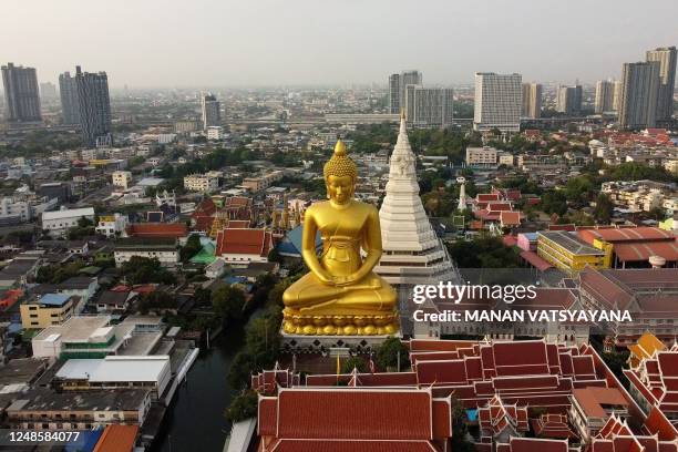 This photo taken on March 17, 2023 shows the 69-meter tall giant Buddha statue of Wat Paknam Phasi Charoen temple in Bangkok. - Thailand's capital...
