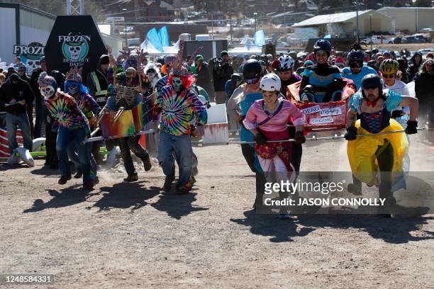 Teams Dead Disney Dreams and Dead Hippies break away from the start line during the coffin races at the Frozen Dead Guy Days festival in Estes Park,...