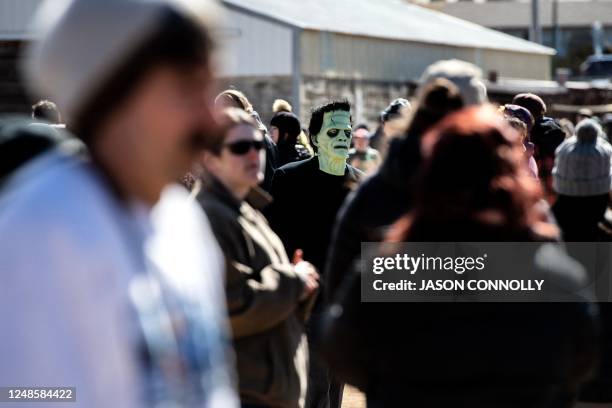 Person dressed as Frankenstein's monster wanders trough the crowd during the Frozen Dead Guy Days festival at the Estes Park Events Complex in Estes...