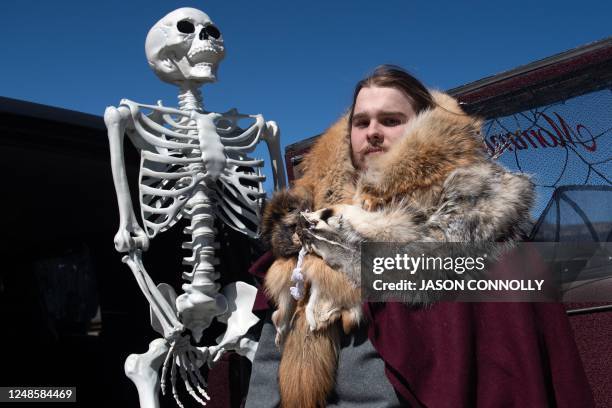 Will Slater of Aurora, Colorado, poses for a portrait at the rear of his familys hearse during the Frozen Dead Guy Days festival at the Estes Park...