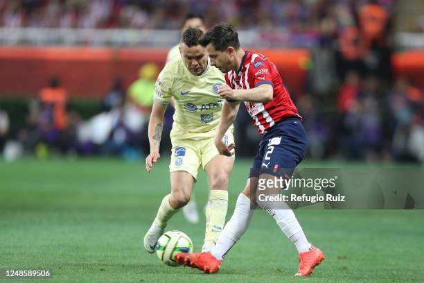Alan Mozo of Chivas fights for the ball with Jonathan Rodríguez of America during the 12th round match between Chivas and America as part of the...