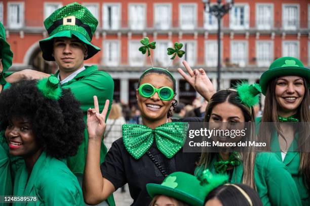 People dressed in the colors of Ireland celebrating Saint Patrick's Day. More than 300 bagpipers have walked the streets of the center of Madrid in a...