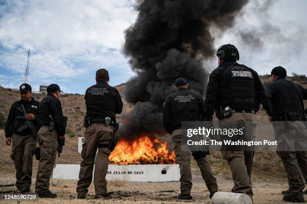 Officials from the Mexican attorney generals office burn thousands of pounds of drugs, including tens of thousands of counterfeit fentanyl pills, at...