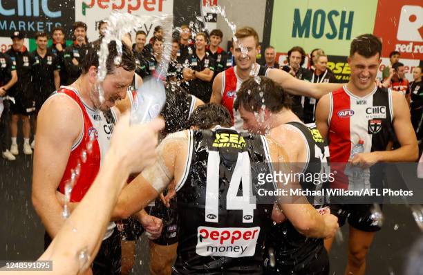 Saints players sing the team song during the 2023 AFL Round 01 match between the St Kilda Saints and the Fremantle Dockers at Marvel Stadium on March...