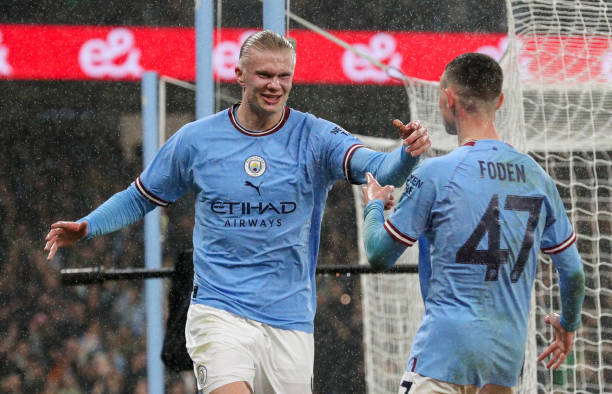 Manchester City's Erling Haaland celebrates scoring his side's second goal with Phil Foden during the Emirates FA Cup Quarter-Final match between...