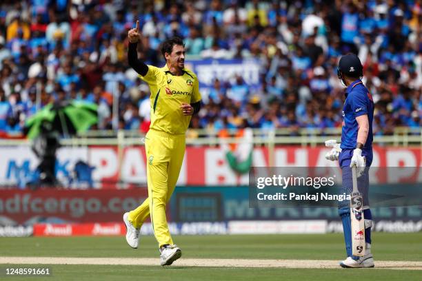 Mitchell Starc of Australia celebrates the wicket of KL Rahul of India during game two in the One Day International Series between India and...