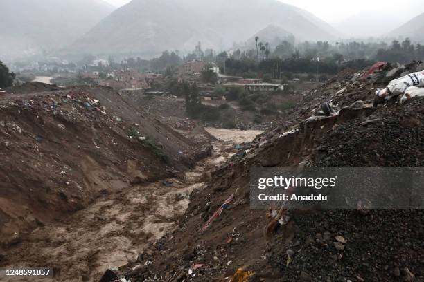 View of the Pedregal ravine with the strong flow of a landslide triggered by heavy rains from Cyclone Yaku in the Chaclacayo district, on the...