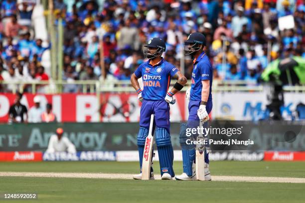 Virat Kohli of India and KL Rahul of India wait for a DRS review during game two in the One Day International Series between India and Australia at...