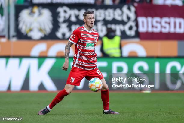 Jeffrey Gouweleeuw of FC Augsburg controls the ball during the Bundesliga match between FC Augsburg and FC Schalke 04 at WWK-Arena on March 18, 2023...