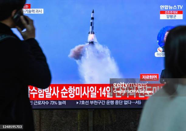 Screen at the Yongsan Railway Station in Seoul, shows file footage of North Korea's missile launch during a news program. North Korea fired a...