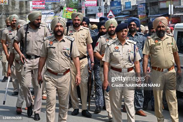 Police and security personnel patrol in a village near Jallupur Khera about 45 km from Amritsar on March 19, 2023. - A manhunt for a radical Sikh...