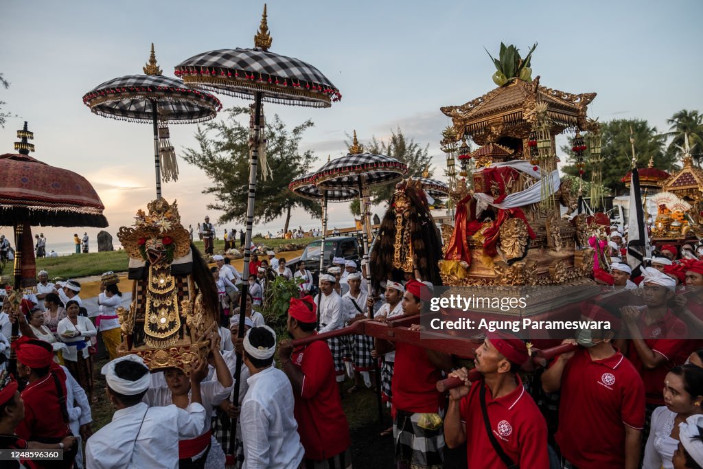 Balinese Ritual Object Balinese Hindus people carry ritual paraphernalia and sacred effigies ...