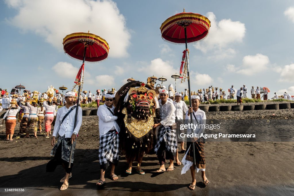 Balinese Ritual Object Balinese Hindus people carry sacred mask, sacred effigies and ritual ...