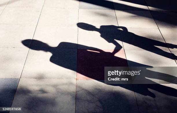 shadow of mother and child - focus on shadow stock pictures, royalty-free photos & images