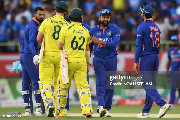 Australia's Mitchell Marsh and Travis Head greeted by India's captain Rohit Sharma , Virat Kohli and KL Rahul at the end of the second one-day...