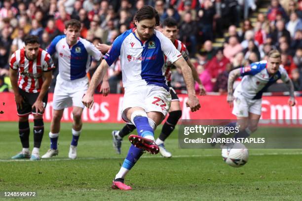 Blackburn Rovers' English striker Ben Brereton shoots a penalty kick and scores his team first goal during the English FA Cup quarter-final football...