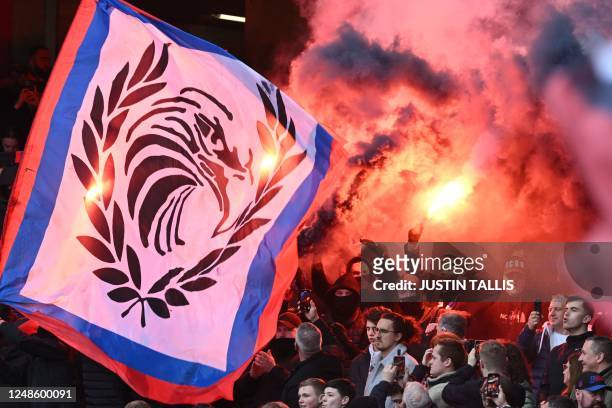 Crystal Palace fans let off flares in the crowd ahead of the English Premier League football match between Arsenal and Crystal Palace at the Emirates...